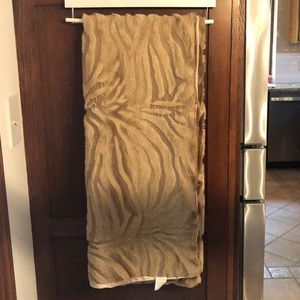 Faux fur polyester throw in tan color.